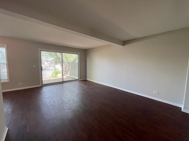 529 Jordan Way Bolingbrook, IL 60440 - Photo 5 of 23 a view of an empty room with wooden floor and a window