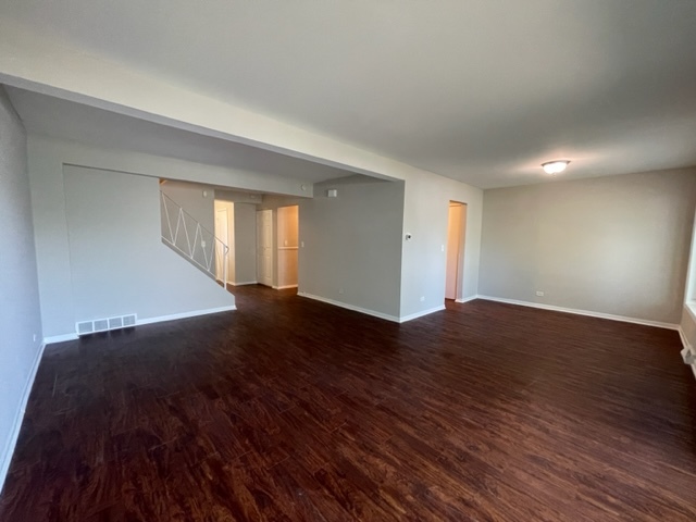 529 Jordan Way Bolingbrook, IL 60440 - Photo 6 of 23 a view of an empty room with wooden floor and a window