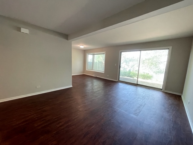 529 Jordan Way Bolingbrook, IL 60440 - Photo 7 of 23 an empty room with wooden floor and windows