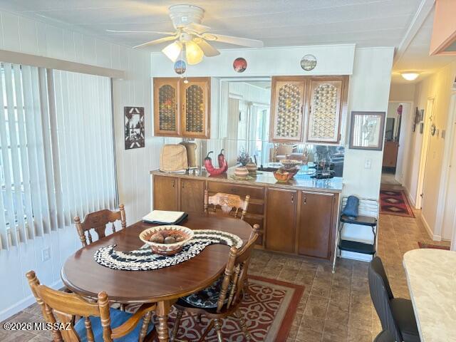 5731 West Flying M Street Tucson, AZ 85713 - Photo 10 of 20 a dining room with furniture a rug and a chandelier