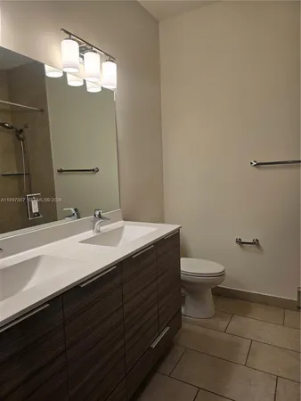 a view of a hallway to rooms