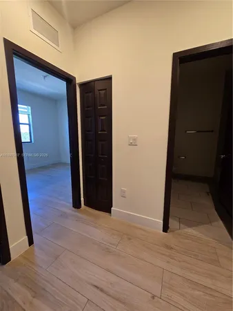 a view of a room with stairs and a chandelier fan