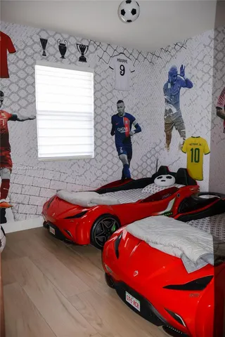 a view of kitchen with microwave and stove top oven
