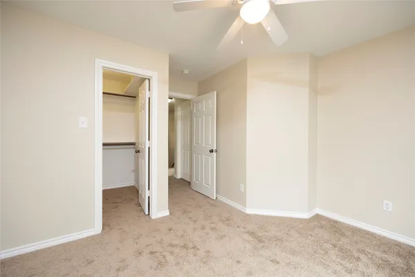 a view of an empty room and fire place