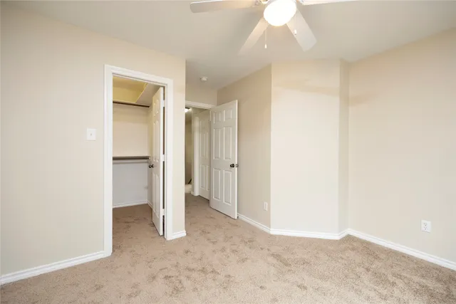 a view of an empty room and fire place