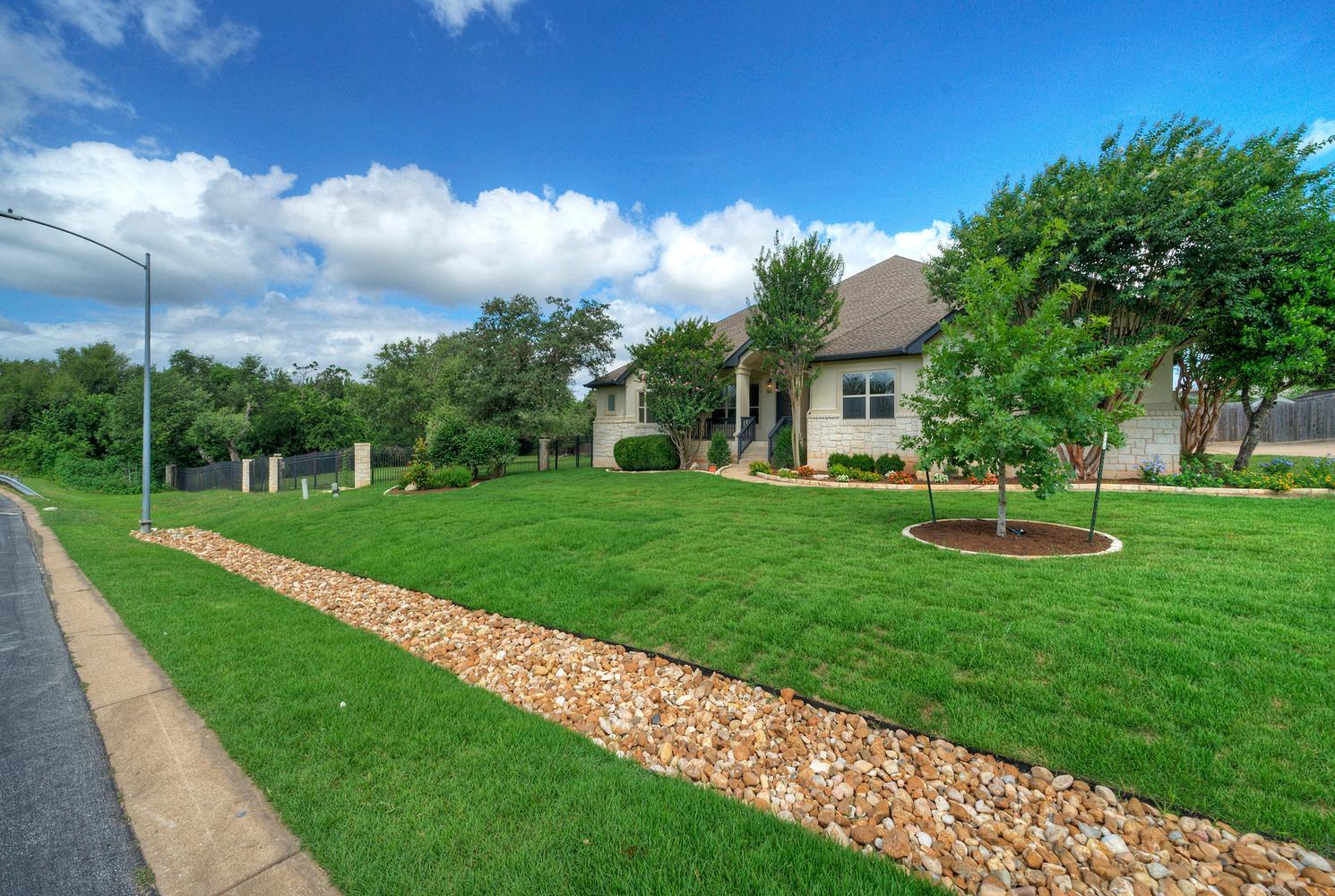 12012 Uplands Ridge Drive Bee Cave, TX 78738 - Photo 1 of 39 Welcome to 12012 Uplands Ridge Drive, where privacy, space, and convenience come together in one of Bee Cave's most desirable gated communities. Set on a rare double lot spanning more than an acre, this beautifully updated property offers room to spread out while remaining just minutes from the Hill Country Galleria, H-E-B, Whole Foods, Trader Joe's, restaurants, and everyday conveniences. Located within the highly acclaimed Lake Travis ISD, residents enjoy easy access to Bee Cave Road, Highway 71, downtown Austin, and Austin-Bergstrom International Airport.