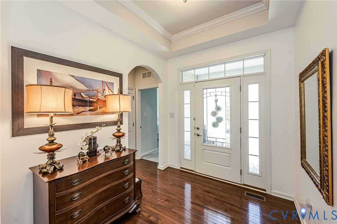 7435 Wicks Road Williamsburg, VA 23188 - Photo 10 of 82 Entryway featuring wood-finish flooring, a white p