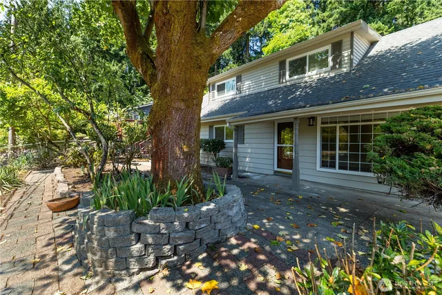 a front view of a house with garden
