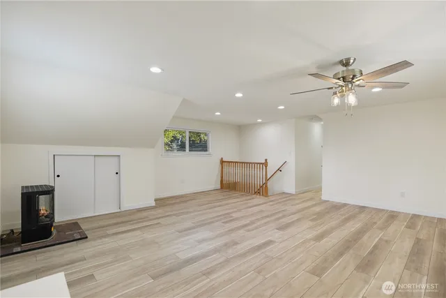 a view of an empty room with a fireplace