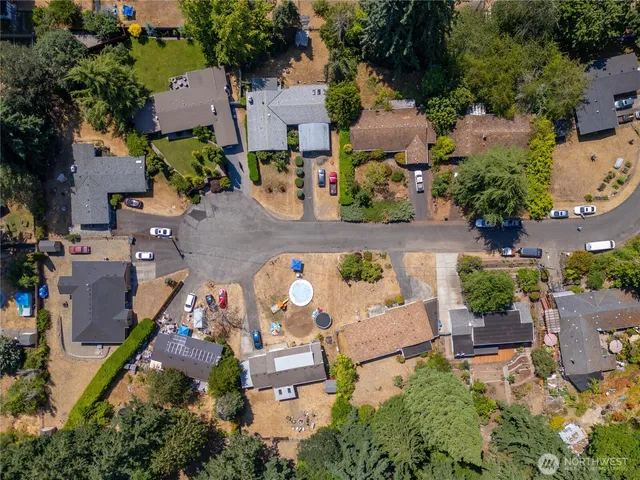 an aerial view of house swimming pool and outdoor seating