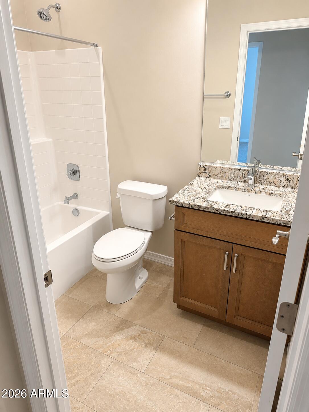786 Flat Iron Road, Unit LOT 503 Clarkdale, AZ 86324 - Photo 11 of 14 a bathroom with a granite countertop sink a toilet and a mirror