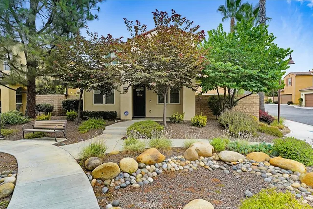 a view of a chair and tables in the patio
