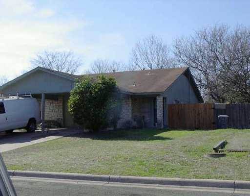 5002 Table Top Trail Austin, TX 78744 - Photo 1 of 1 a front view of a house with a yard