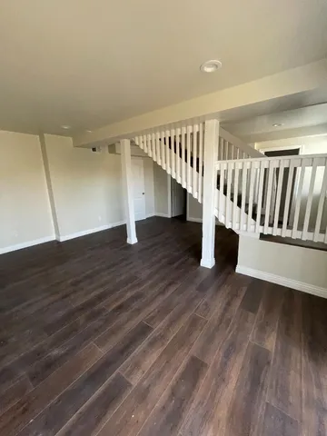 a kitchen with stainless steel appliances granite countertop a sink and a refrigerator