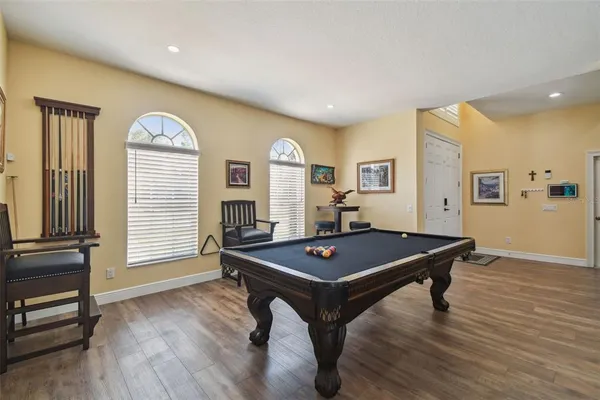 a living room with furniture kitchen view and a fireplace