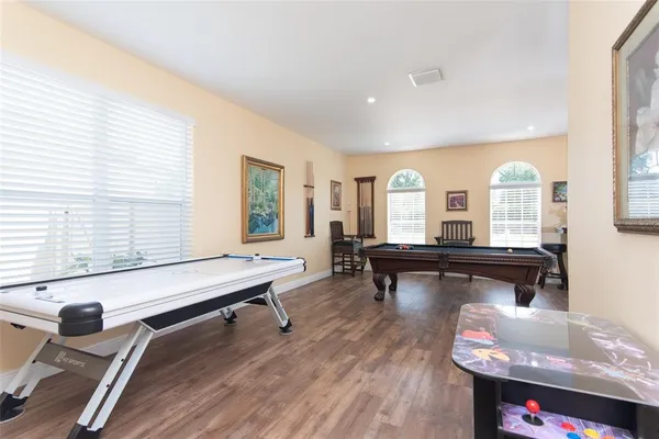 a view of a dining room with furniture and wooden floor