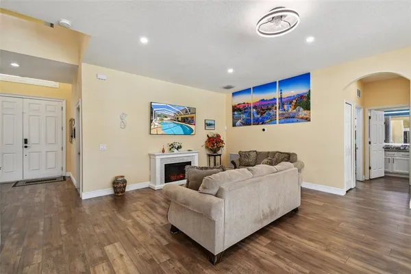 a dining room with furniture window and wooden floor