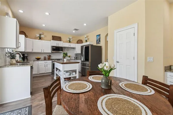 a kitchen with a sink and a stove top oven