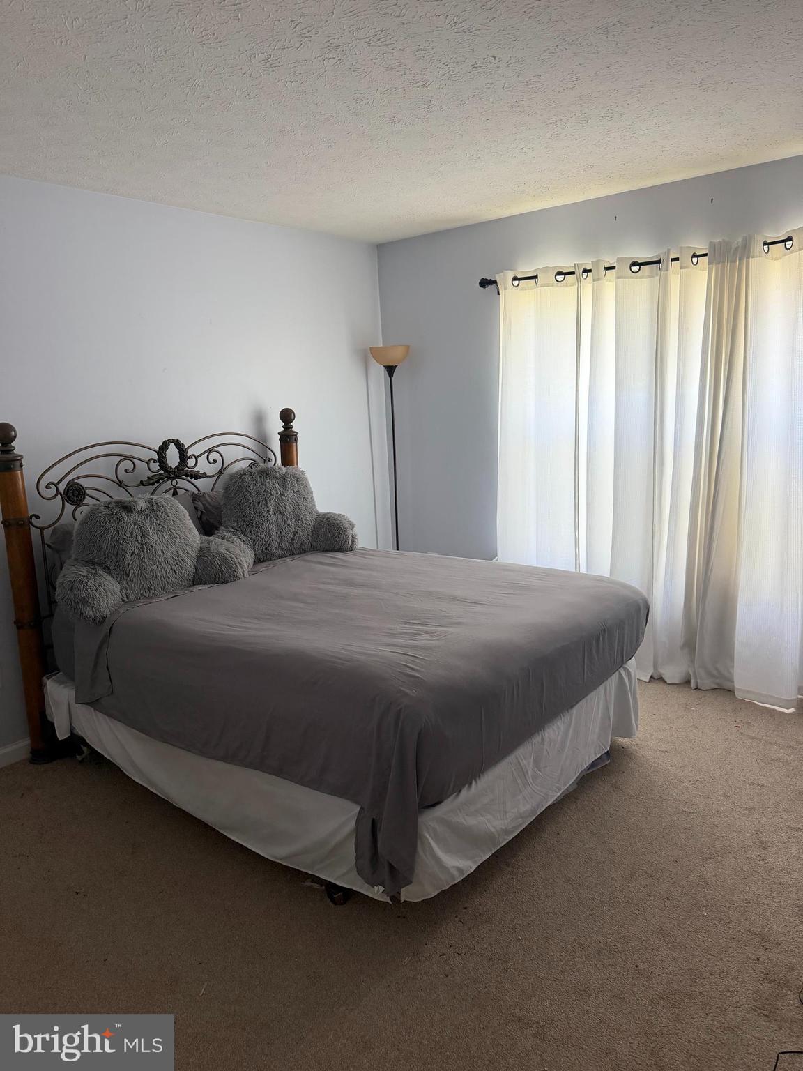 2969 Siwanoy Drive Edgewood, MD 21040 - Photo 8 of 12 a spacious bedroom with a bed and a window
