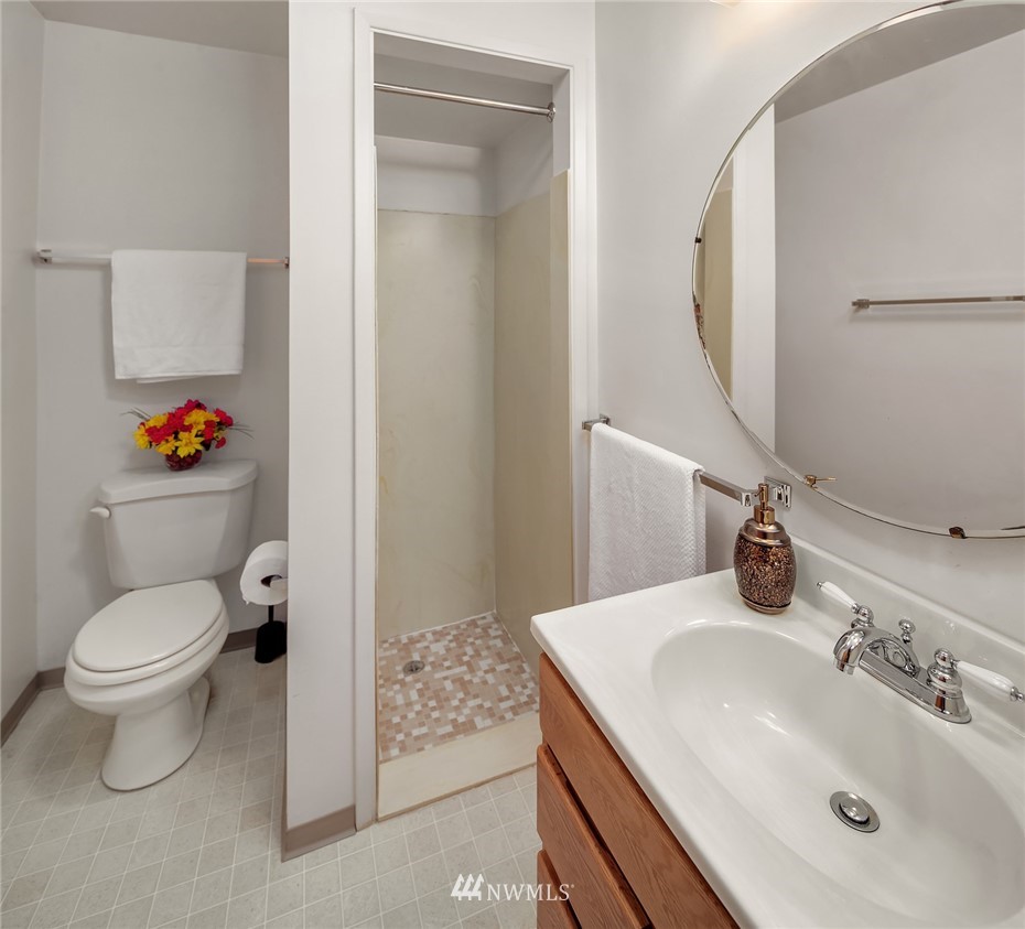 508 Northwest 4th Place Renton, WA 98057 - Photo 22 of 26 a bathroom with a sink toilet and a mirror