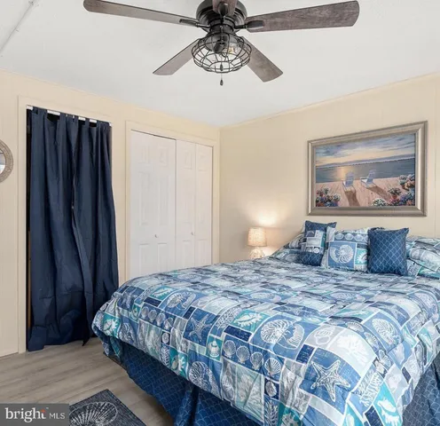 a bathroom with a sink a toilet and shower curtain