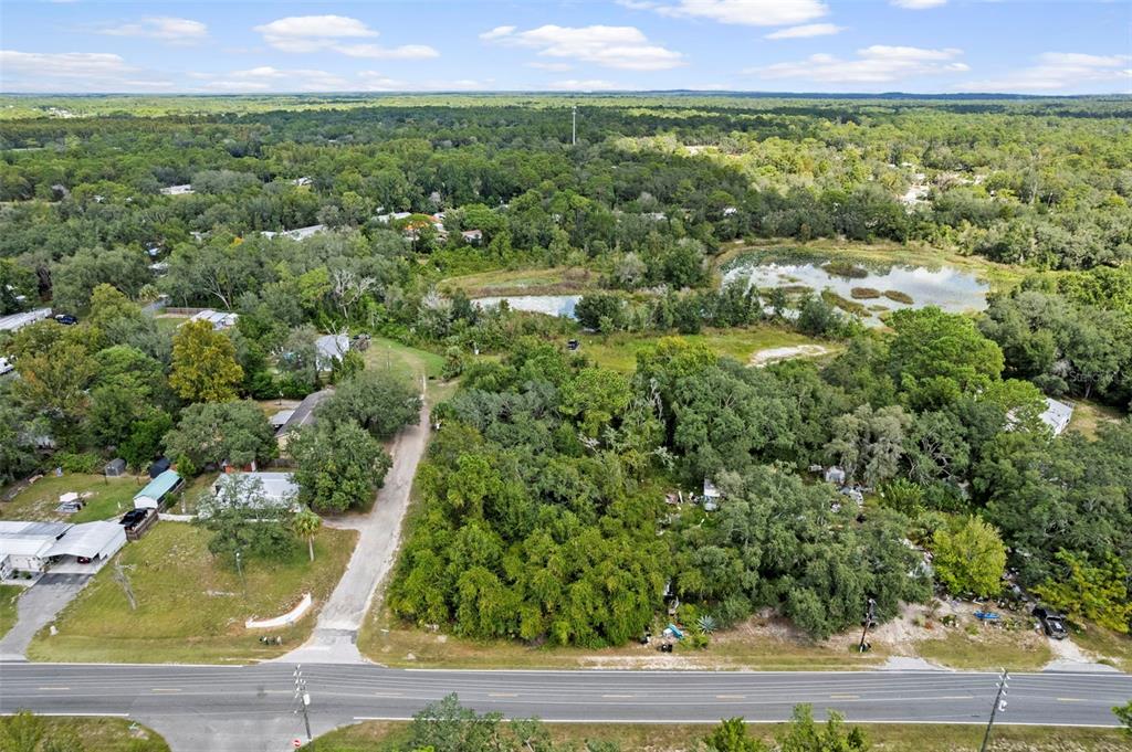 6669 West Cardinal Street Homosassa, FL 34446 - Photo 3 of 14 an aerial view of residential houses with outdoor space and trees