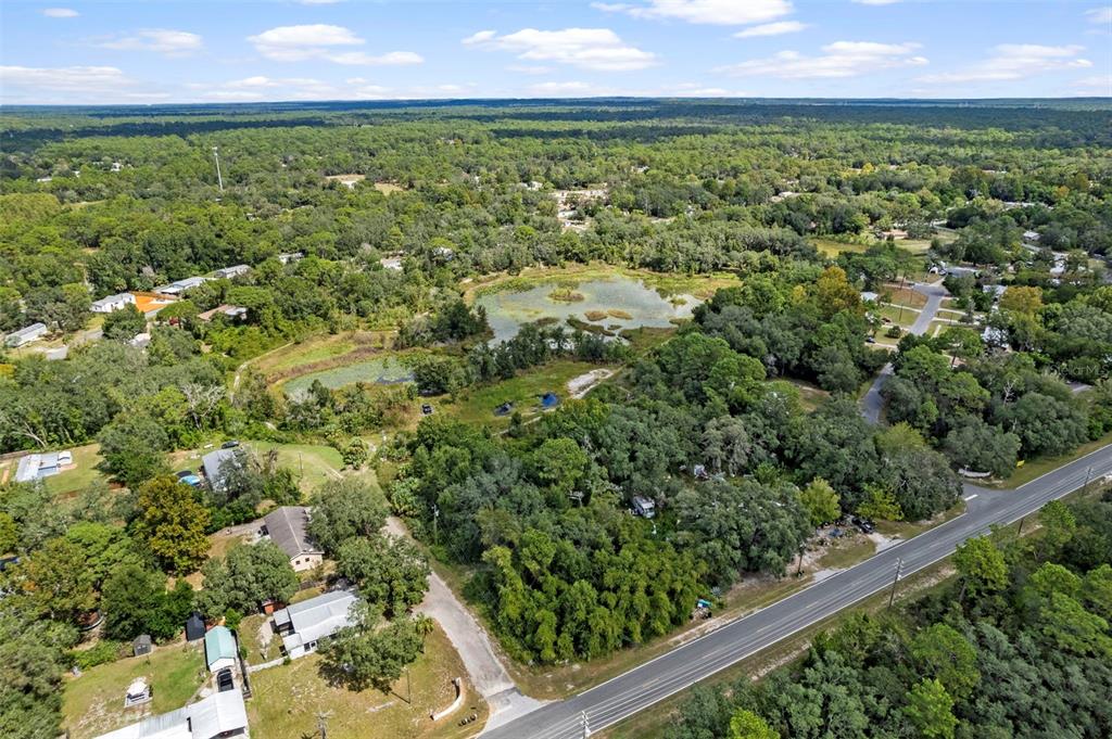 6669 West Cardinal Street Homosassa, FL 34446 - Photo 10 of 14 an aerial view of residential houses with outdoor space and trees