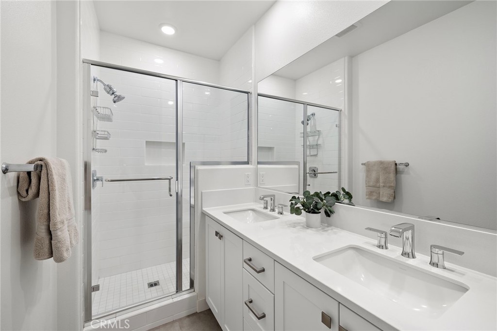 61 Wheelbarrow Road Rancho Mission Viejo, CA 92694 - Photo 16 of 74 a bathroom with a double vanity sink mirror and double