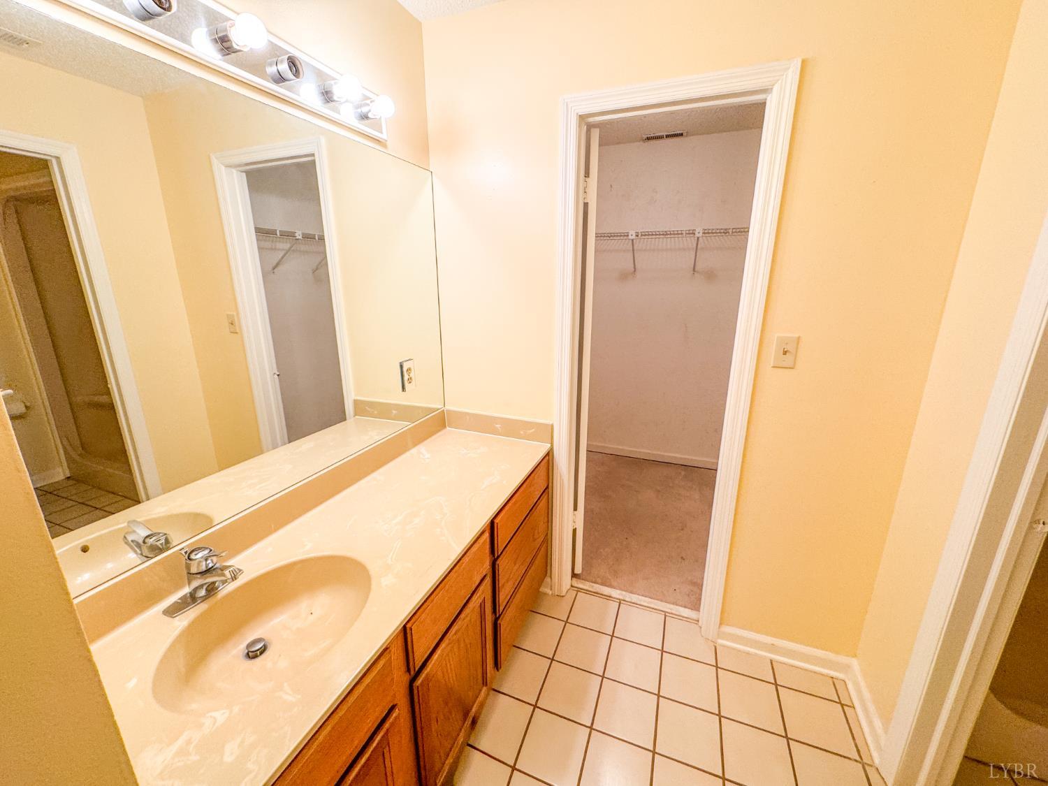 101 Manor Drive, Unit A Forest, VA 24551 - Photo 23 of 40 a bathroom with a tub sink vanity and granite