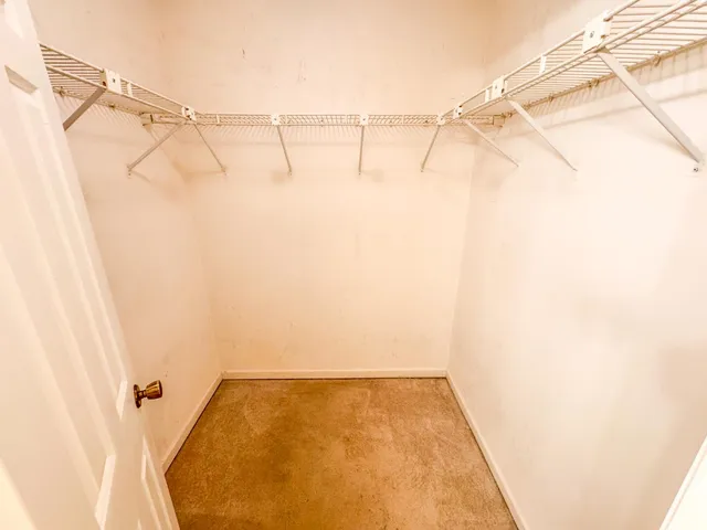 a bathroom with a tub sink and vanity