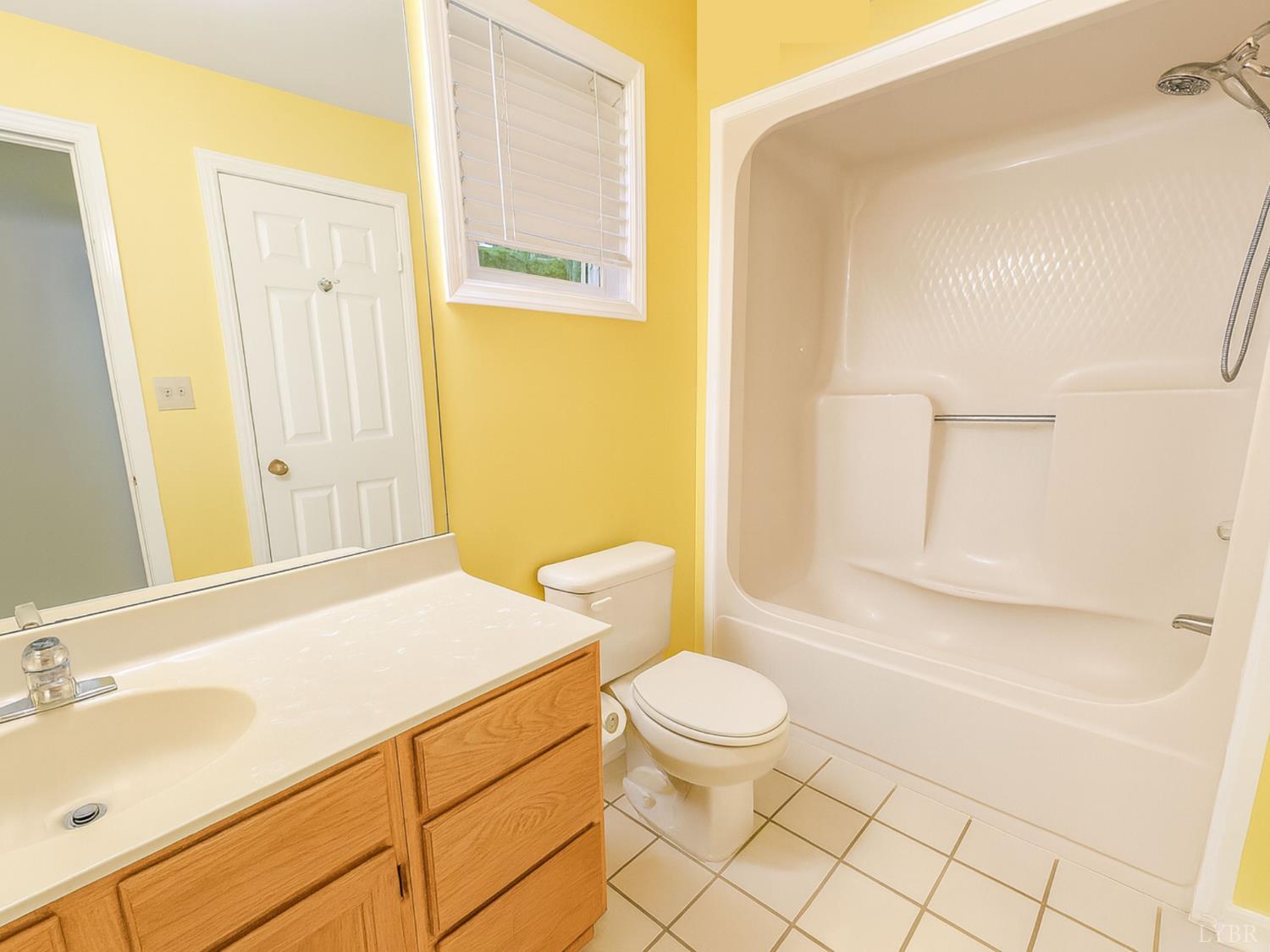 101 Manor Drive, Unit A Forest, VA 24551 - Photo 34 of 40 a bathroom with a sink a toilet and shower