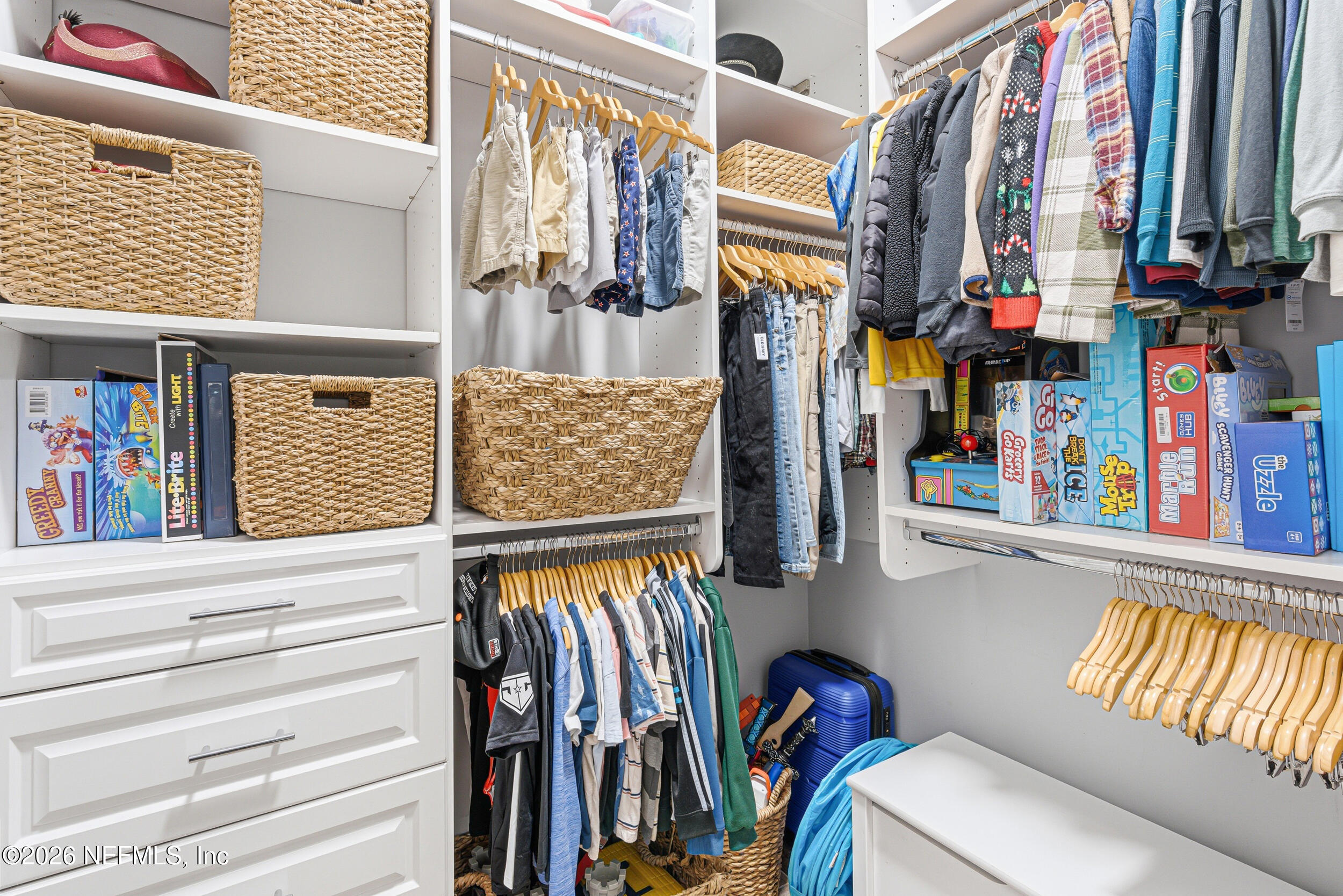 294 Sandy Cove St. Johns, FL 32259 - Photo 28 of 49 a view of walk in closet with clothes and shoes