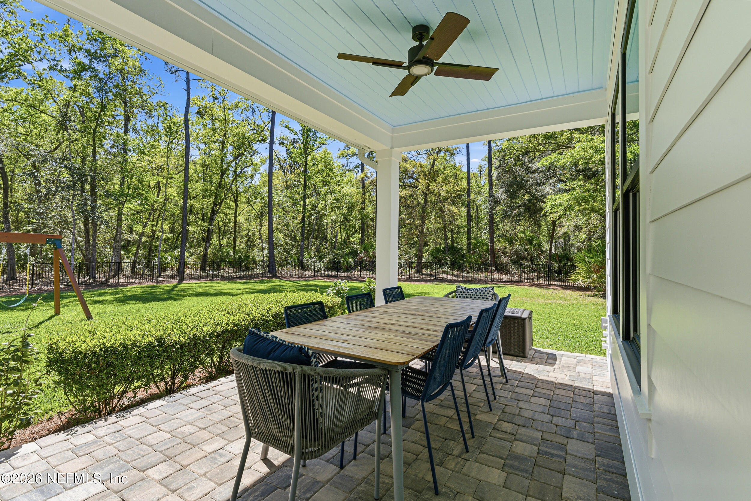 294 Sandy Cove St. Johns, FL 32259 - Photo 35 of 49 a view of a patio with a table chairs and a yard