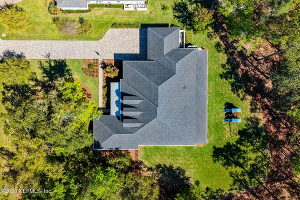 a view of walk in closet with clothes