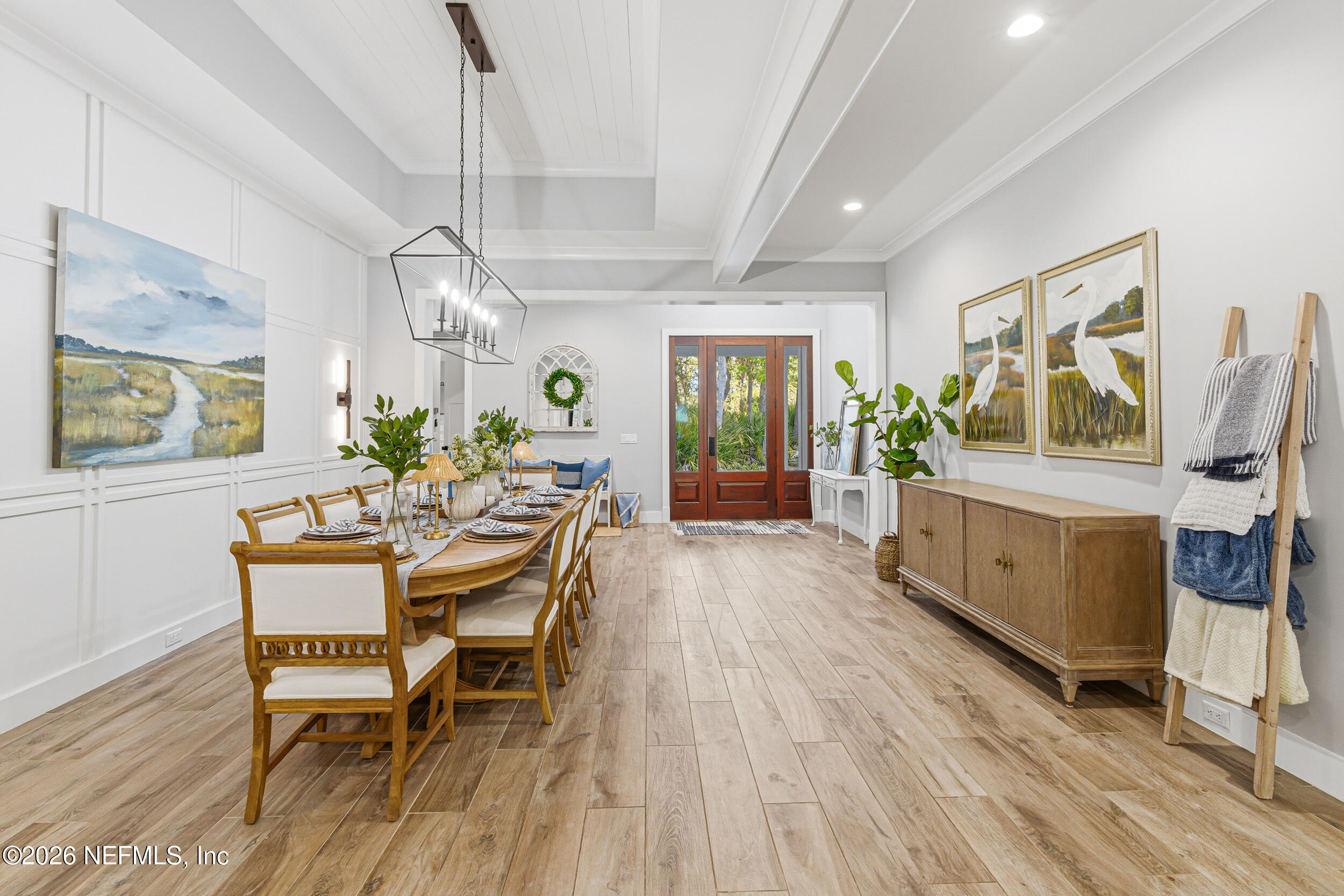 294 Sandy Cove St. Johns, FL 32259 - Photo 9 of 49 a view of a dining room with furniture a chandelier and wooden floor