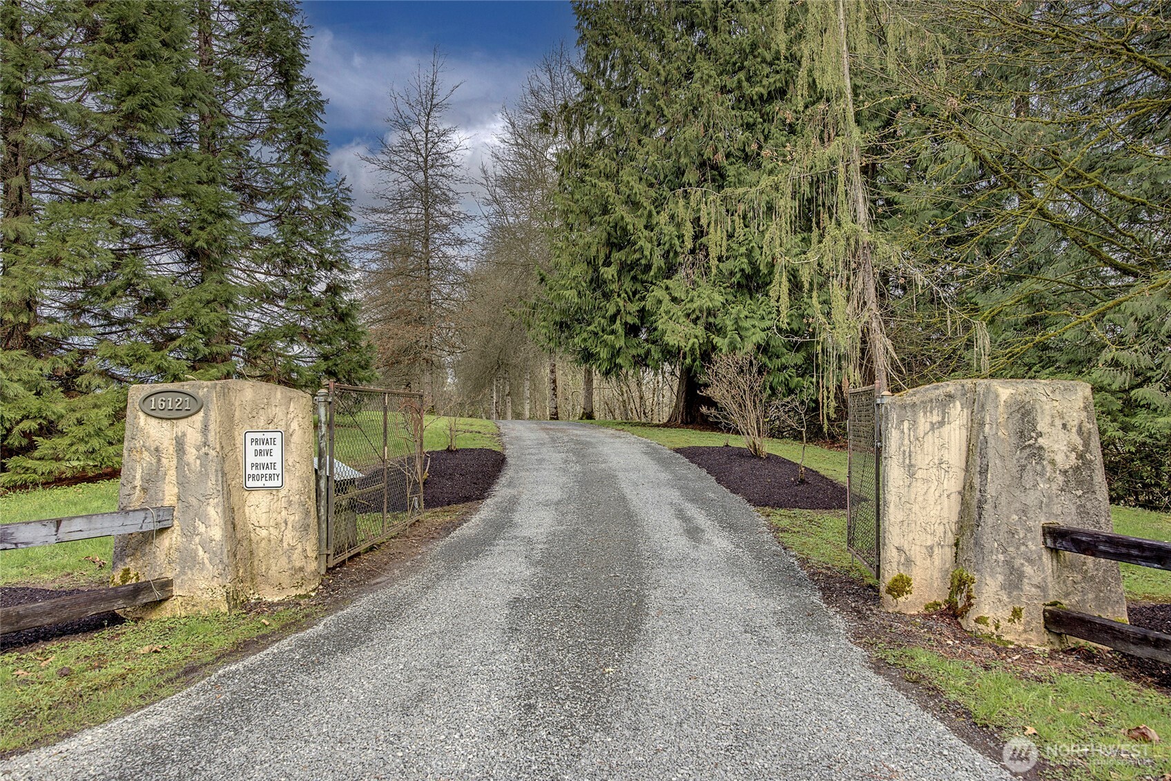 16121 High Bridge Road Monroe, WA 98272 - Photo 1 of 40 a view of a street with a building in the background