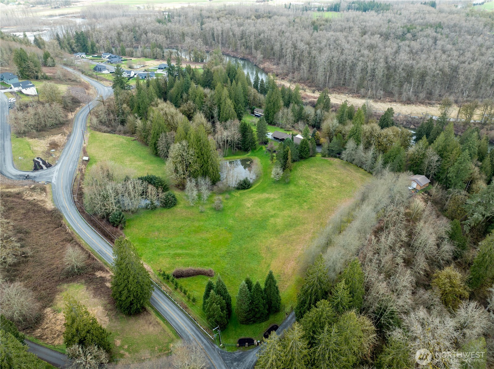 16121 High Bridge Road Monroe, WA 98272 - Photo 2 of 40 a view of a garden with a lake