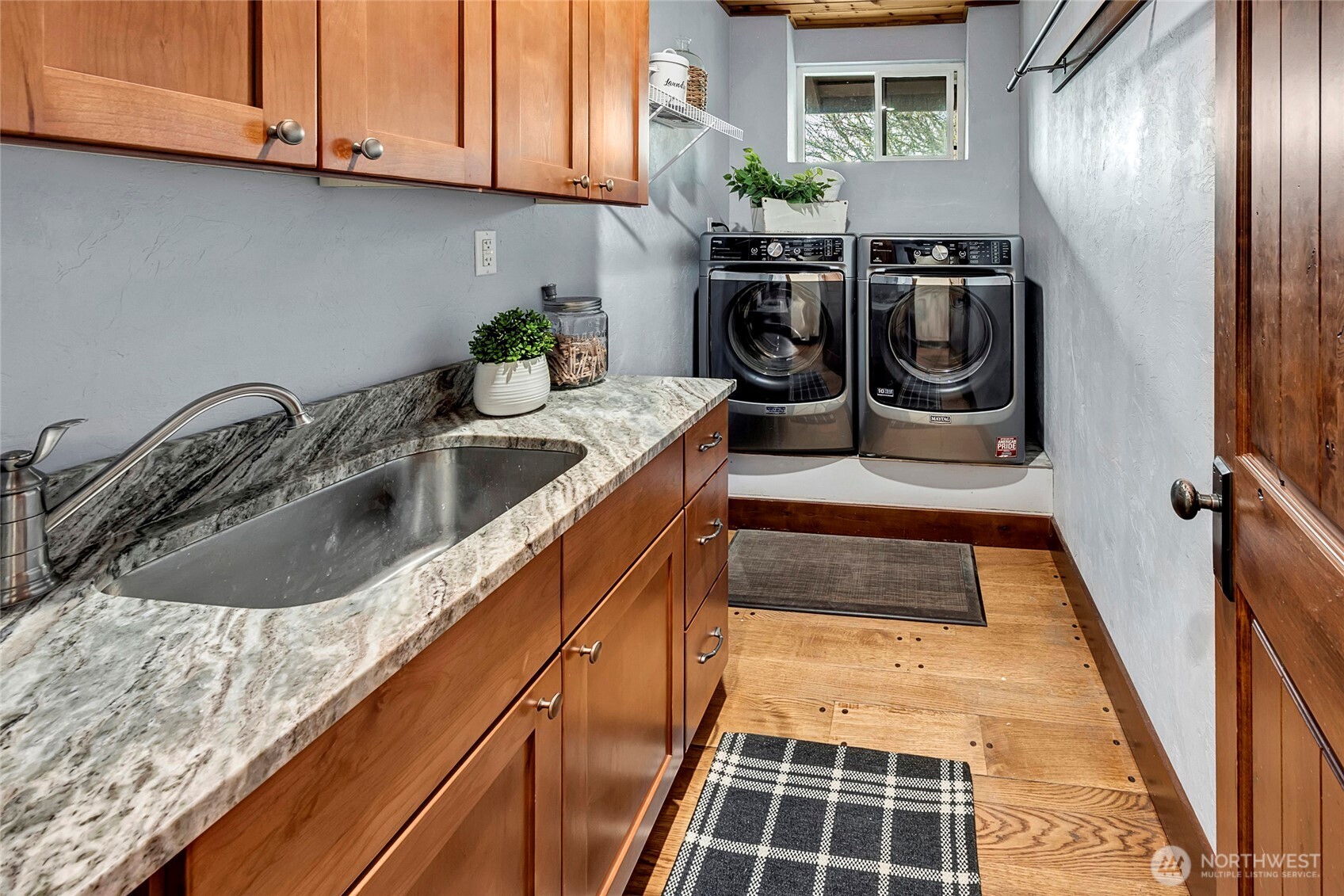 16121 High Bridge Road Monroe, WA 98272 - Photo 22 of 40 a kitchen with a sink and cabinets