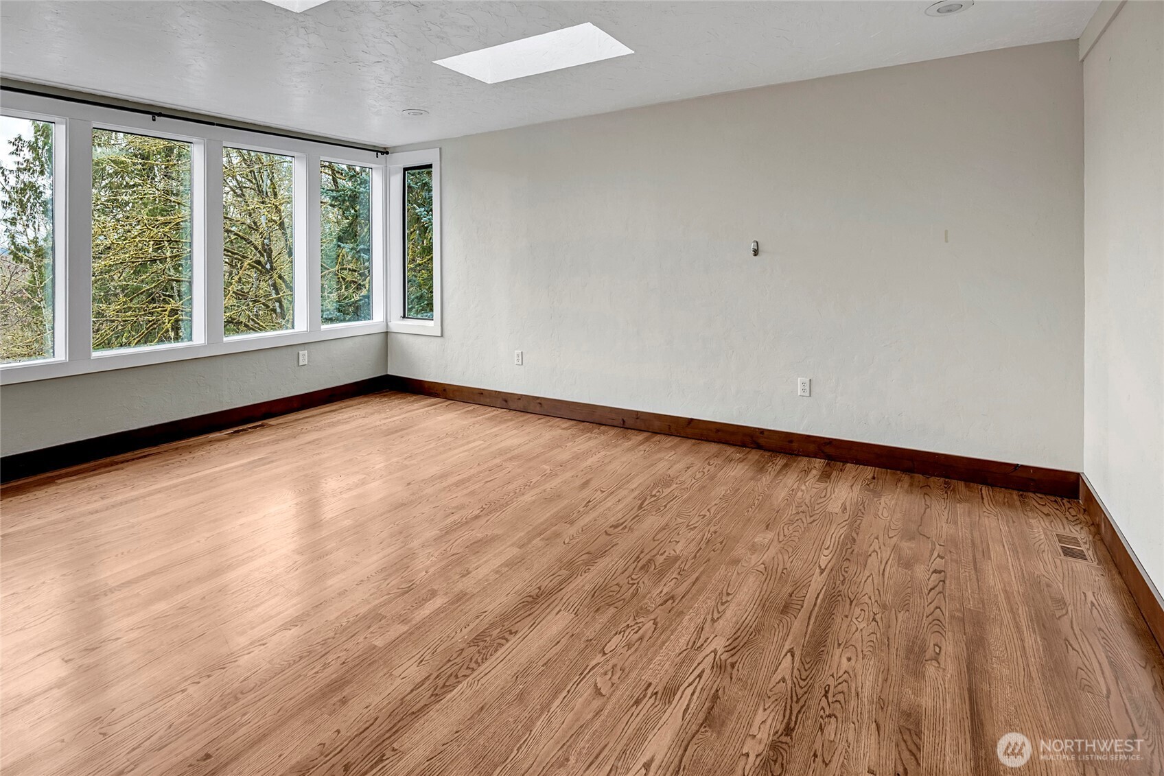 16121 High Bridge Road Monroe, WA 98272 - Photo 24 of 40 a view of an empty room with wooden floor and a window