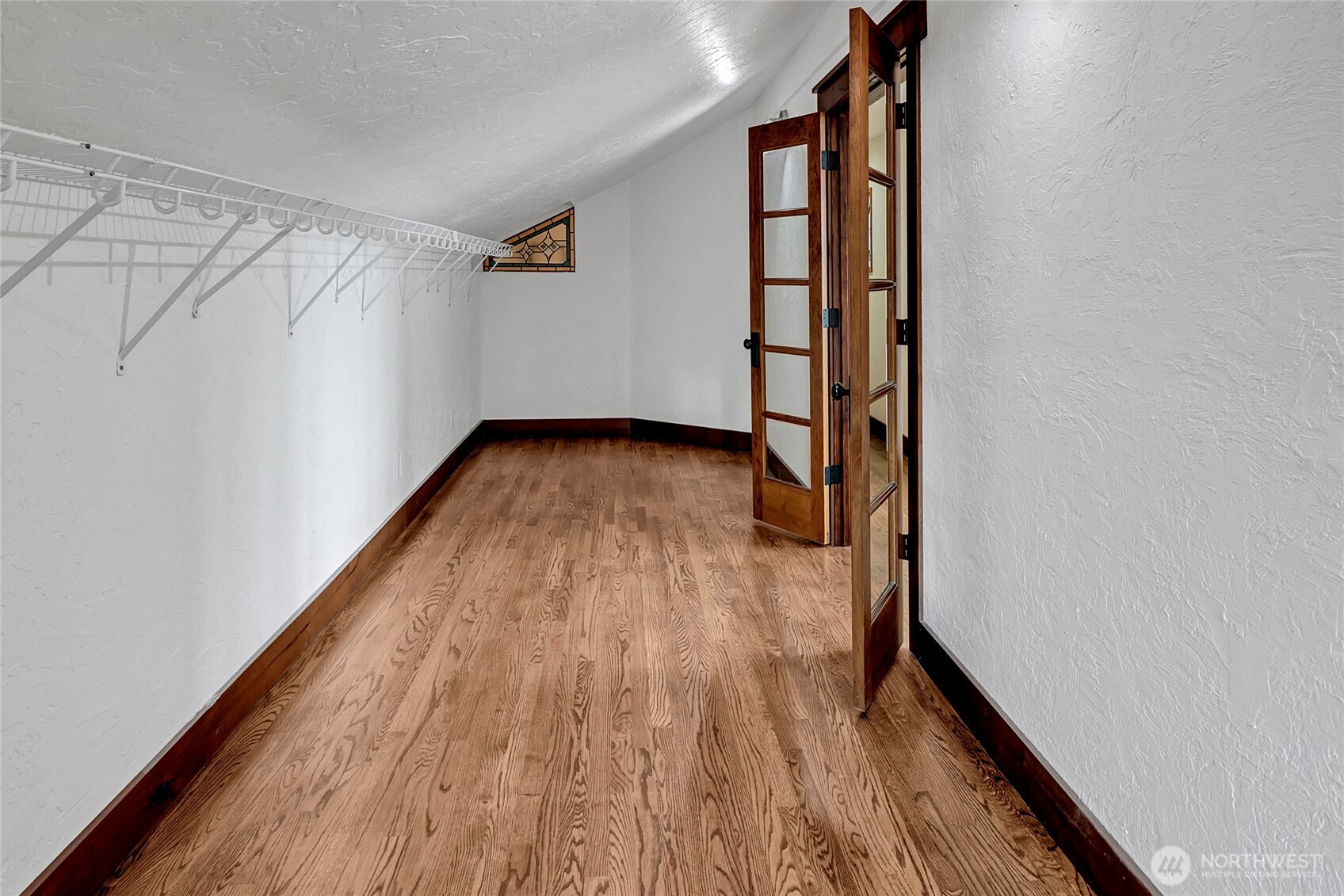 16121 High Bridge Road Monroe, WA 98272 - Photo 25 of 40 a view of a hallway with wooden floor and staircase