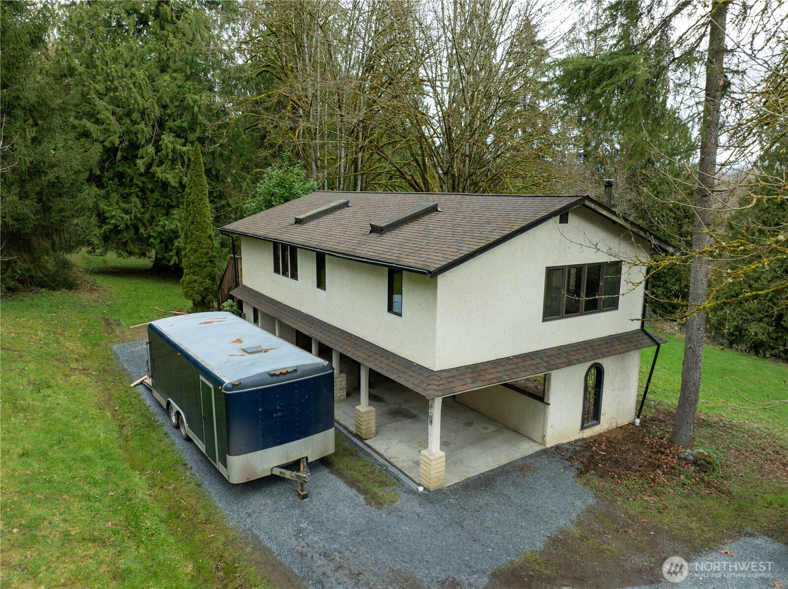 16121 High Bridge Road Monroe, WA 98272 - Photo 31 of 40 a view of a house with a yard and furniture