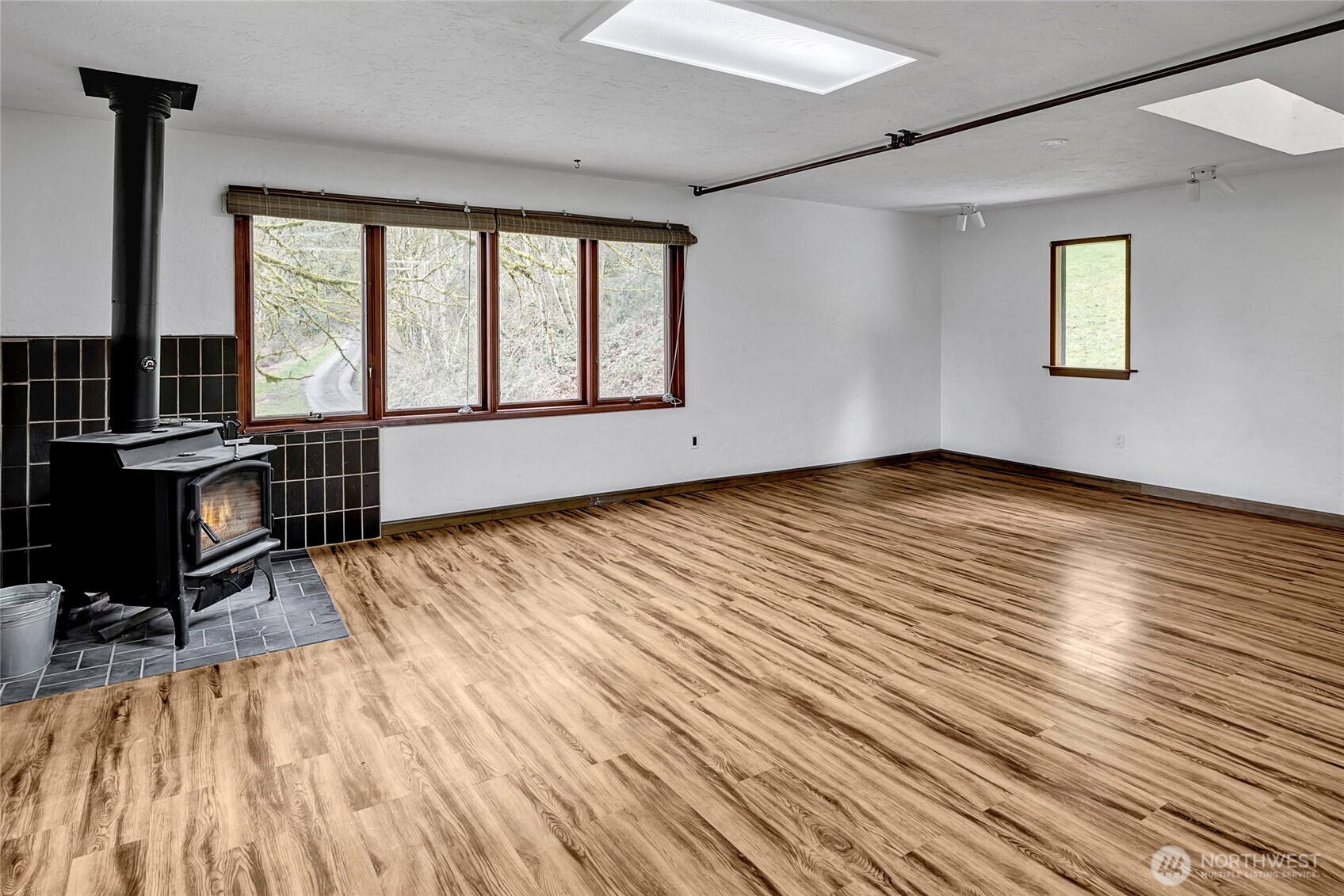 16121 High Bridge Road Monroe, WA 98272 - Photo 33 of 40 a view of a room with wooden floor and furniture