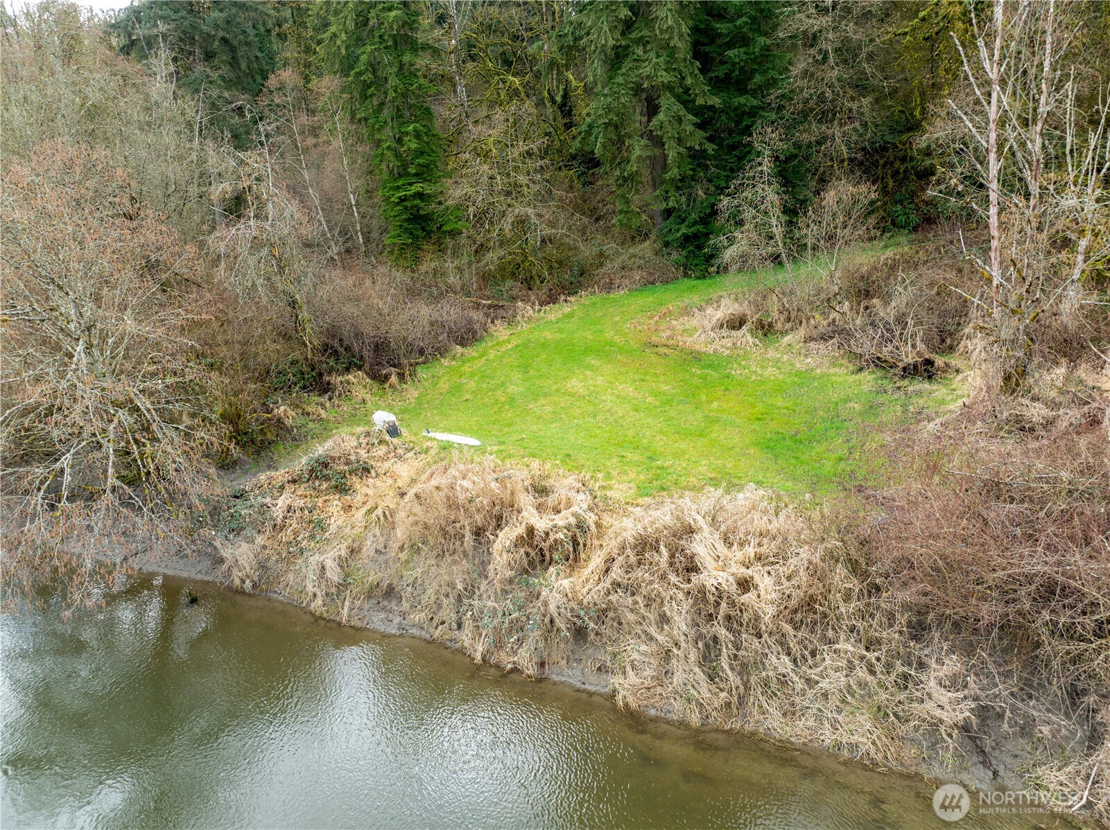 16121 High Bridge Road Monroe, WA 98272 - Photo 36 of 40 a view of a lake with a yard