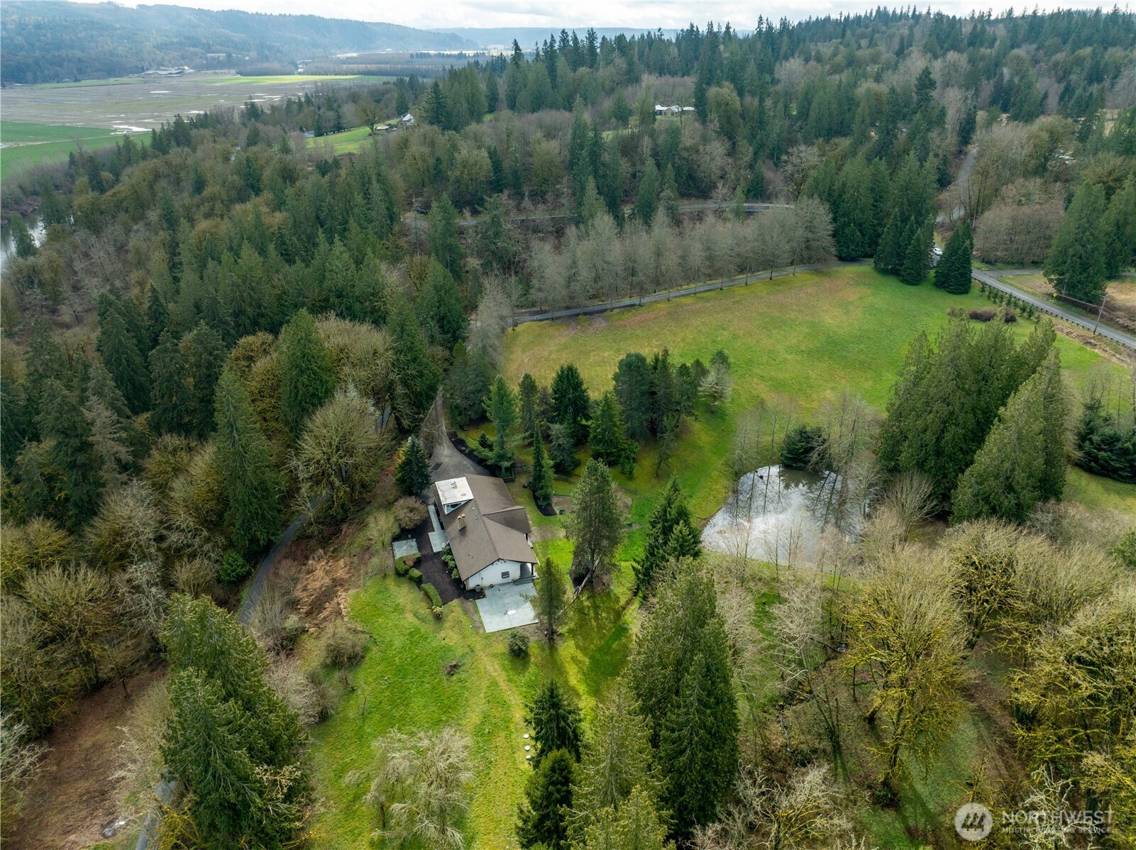 16121 High Bridge Road Monroe, WA 98272 - Photo 40 of 40 a view of a lake with green space