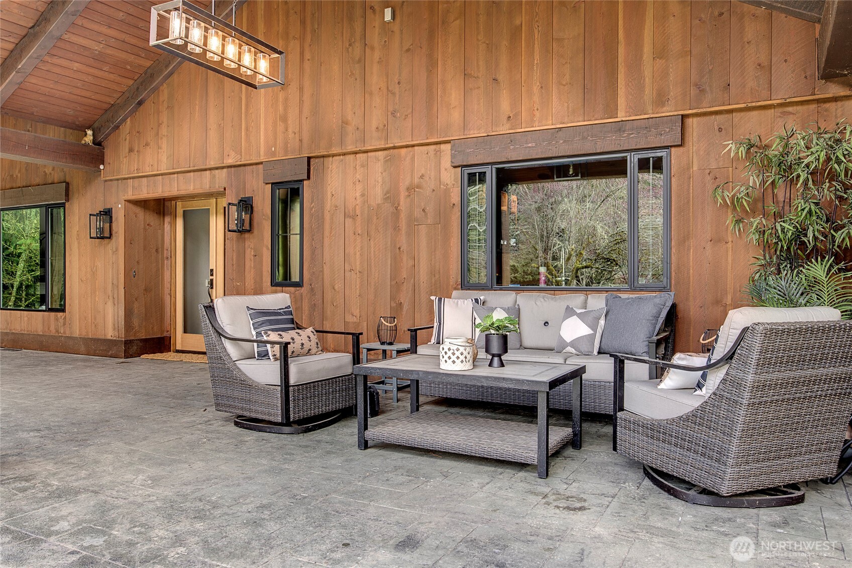 16121 High Bridge Road Monroe, WA 98272 - Photo 4 of 40 a outdoor space with patio furniture and potted plants