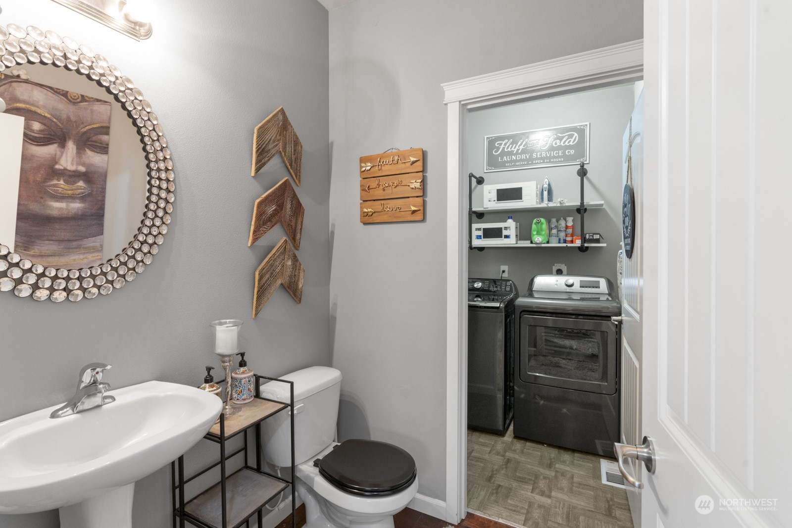 1330 Farina Loop Southeast Olympia, WA 98513 - Photo 13 of 35 a bathroom with a toilet a sink and a mirror