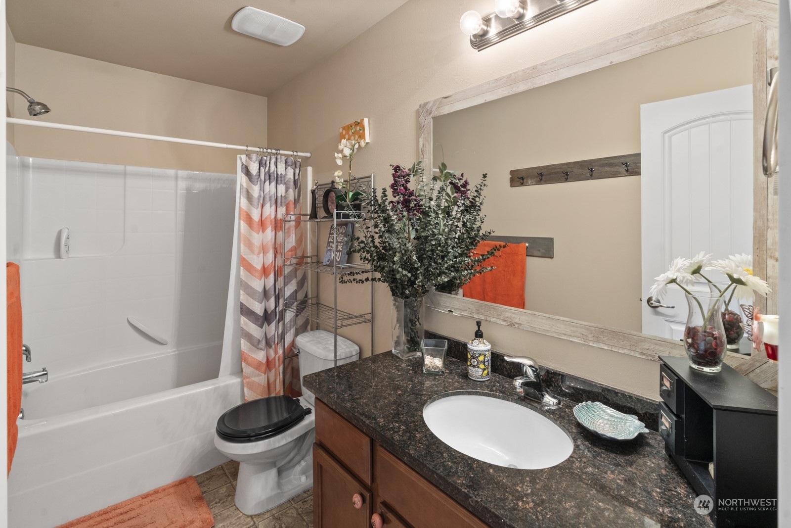 1330 Farina Loop Southeast Olympia, WA 98513 - Photo 25 of 35 a bathroom with a granite countertop sink and a mirror