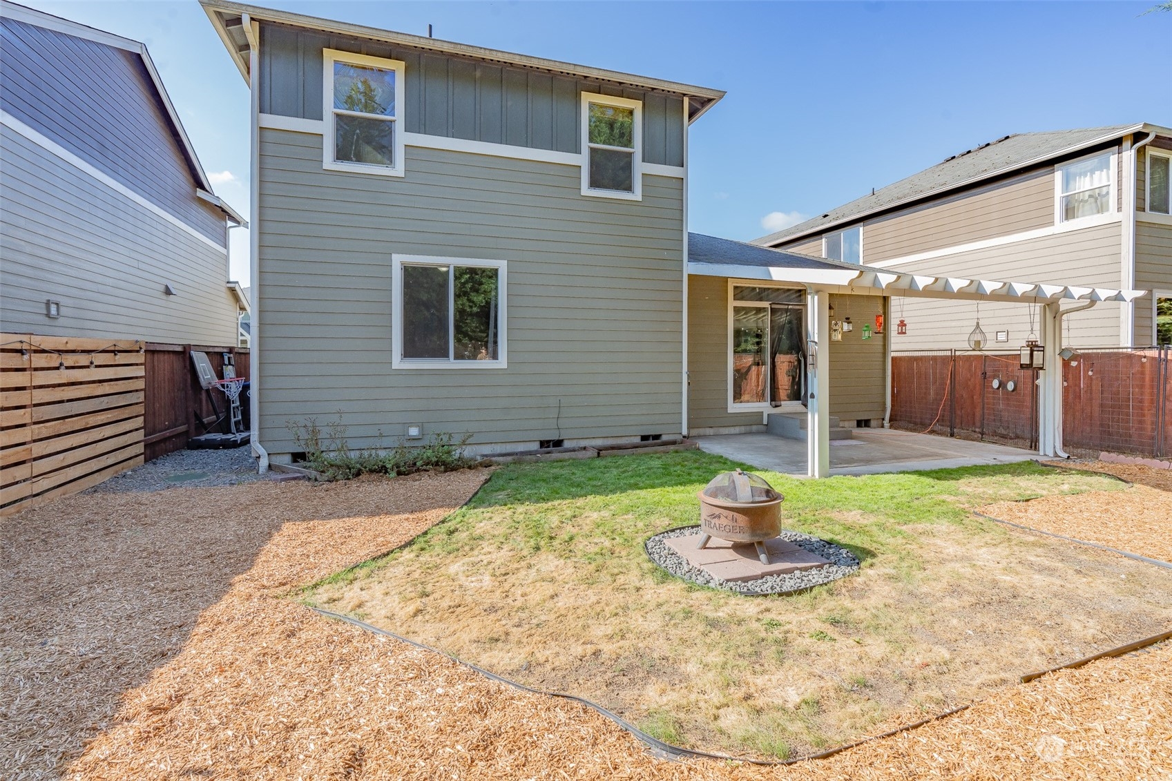 1330 Farina Loop Southeast Olympia, WA 98513 - Photo 27 of 35 a front view of a house with a yard