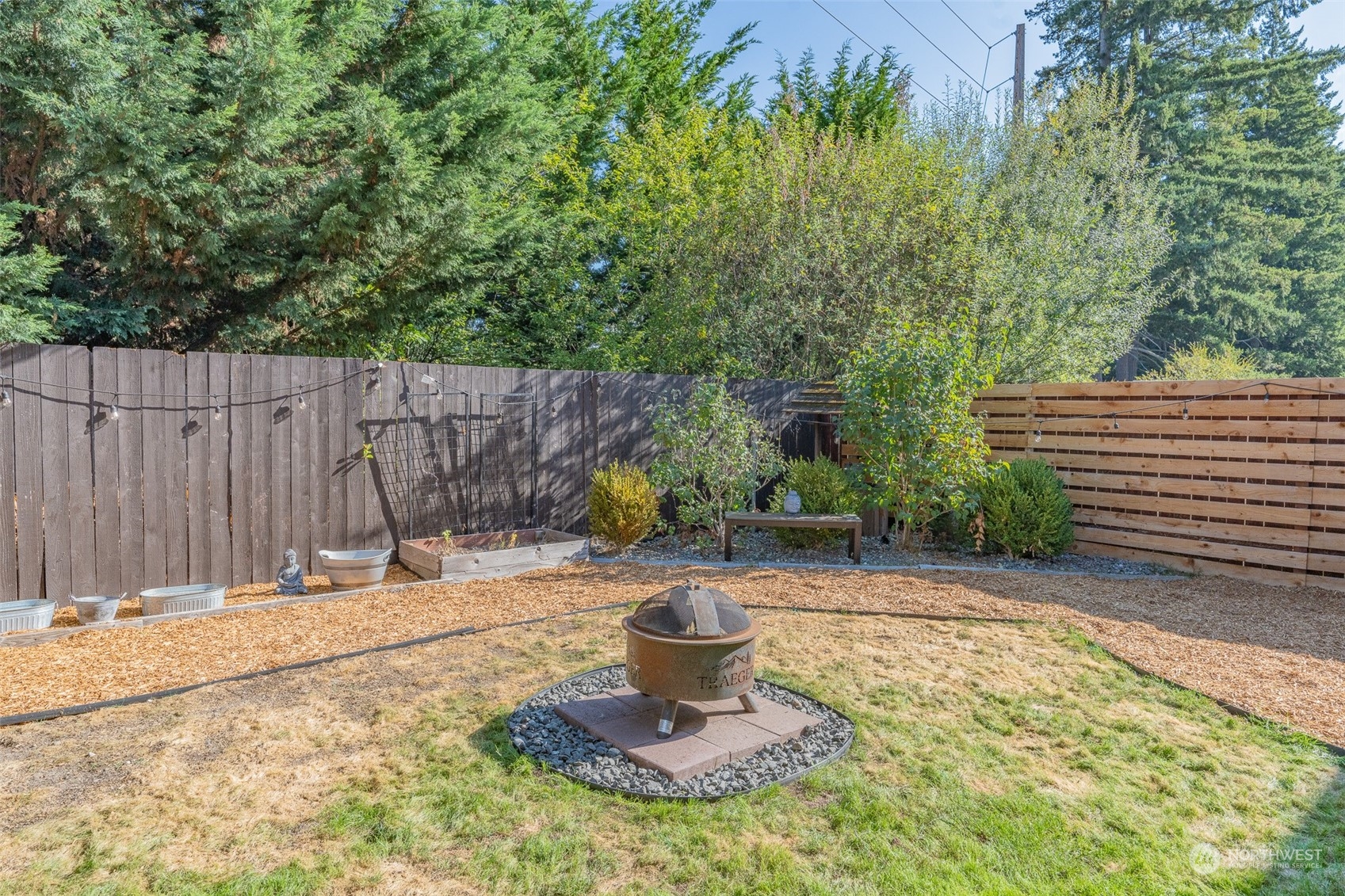1330 Farina Loop Southeast Olympia, WA 98513 - Photo 28 of 35 a backyard of a house with table and chairs