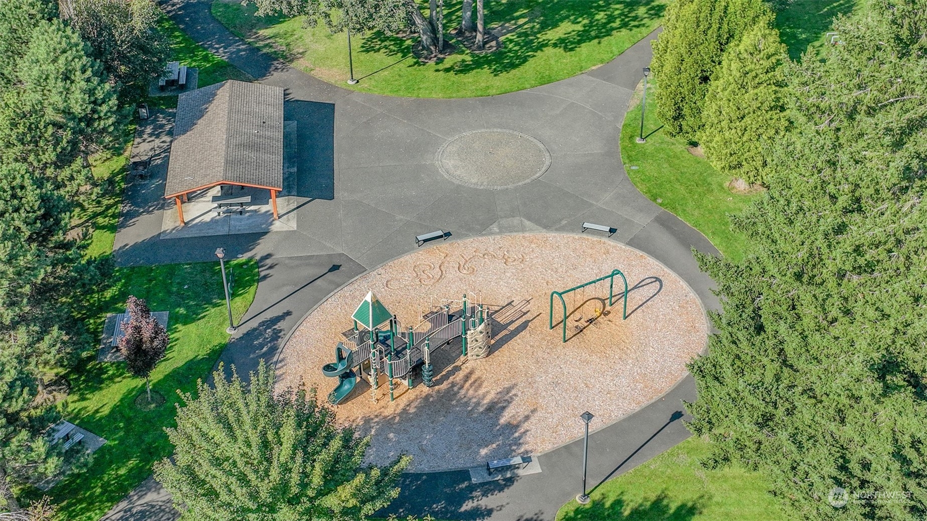 1330 Farina Loop Southeast Olympia, WA 98513 - Photo 32 of 35 an aerial view of a house with a yard and trees